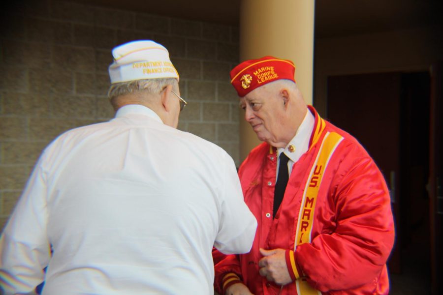 Veterans share stories following the annual Veterans Day program at Vincennes University on Nov. 8.