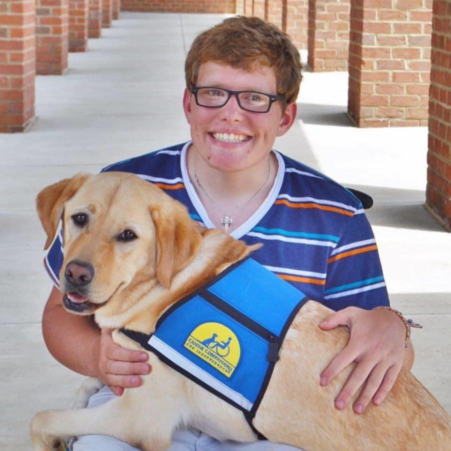 Parker Timberman and his service dog Herb.