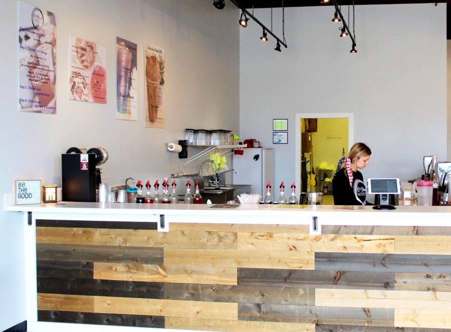 A cafe worker prepares an order at 6th Street Nutrition.