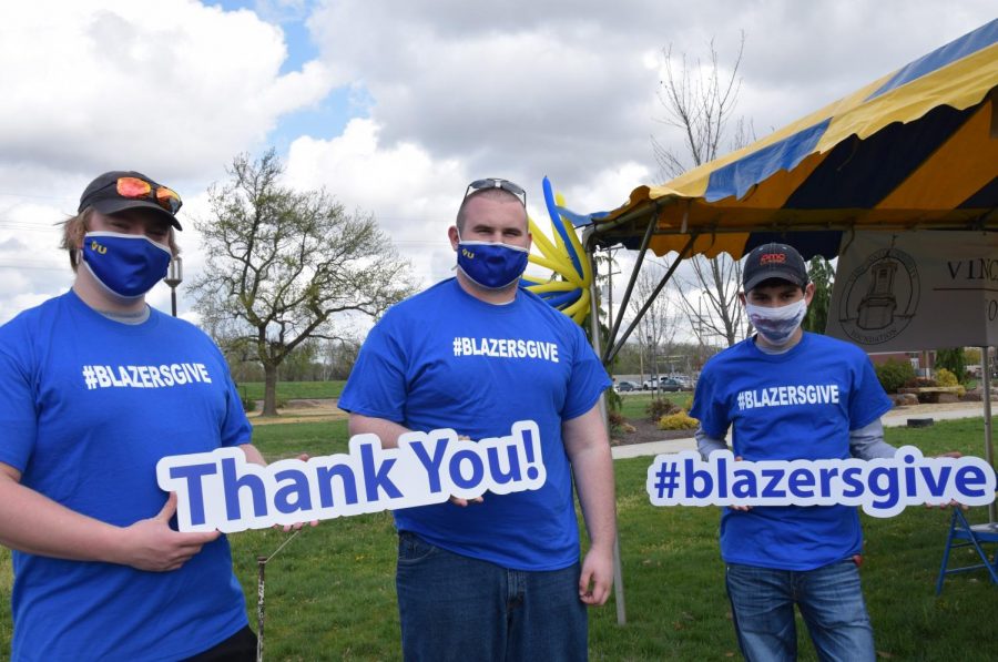 Students stopped by a tent set up for Blazers Give day.