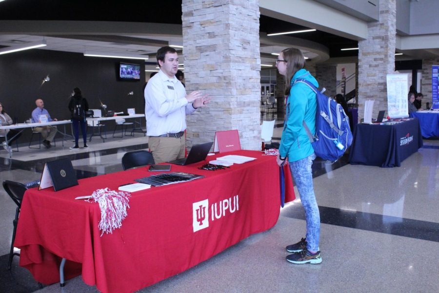 A student talks with a representative from IUPUI during the Transfer Fair.