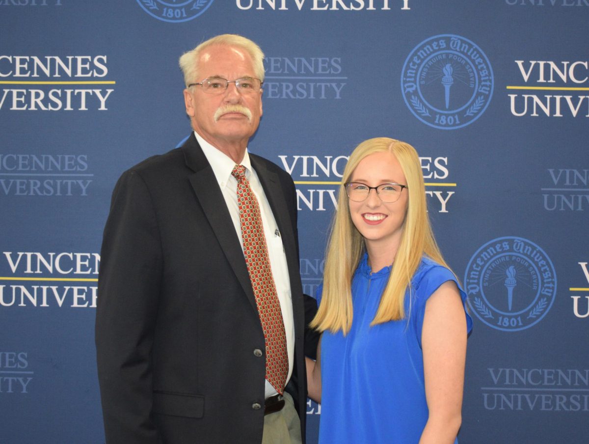 Mike Sievers, left, was elected chairman of the Vincennes University Board of Trustees during its annual meeting on Monday. Gayle Baugh, right, was also sworn in for a history-making second term as student trustee.
