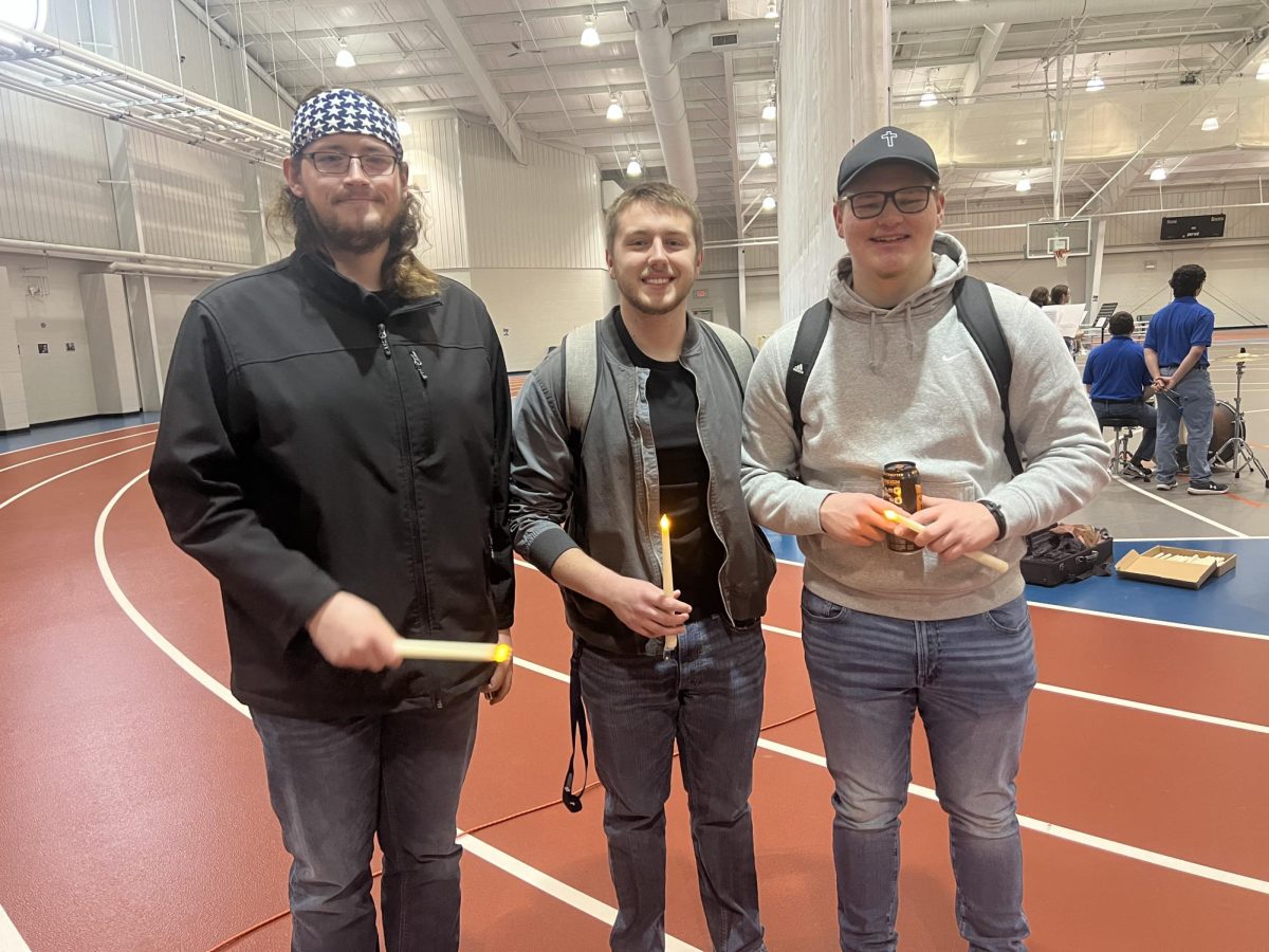 Vincennes University students Sam (left), Greg (middle), and Isaac (right), pose for a picture at Thursday morning’s MLK Walk, held at the Rec Center.