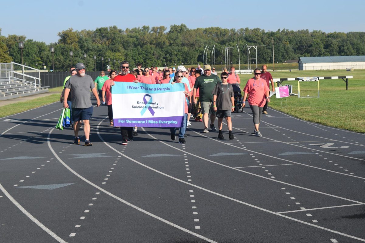 Participants in this year's Knox County Suicide Prevention Walk kick things off Saturday at the track.