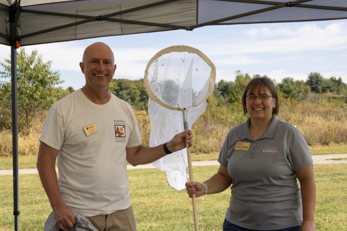 Vincennes University's Curt Coffman and Valerie Clingerman with the Knox County Purdue Extension show off one of the many nets that were used to catch monarch butterflies during the Monarch Madness event held Saturday at Fox Ridge Nature Park.