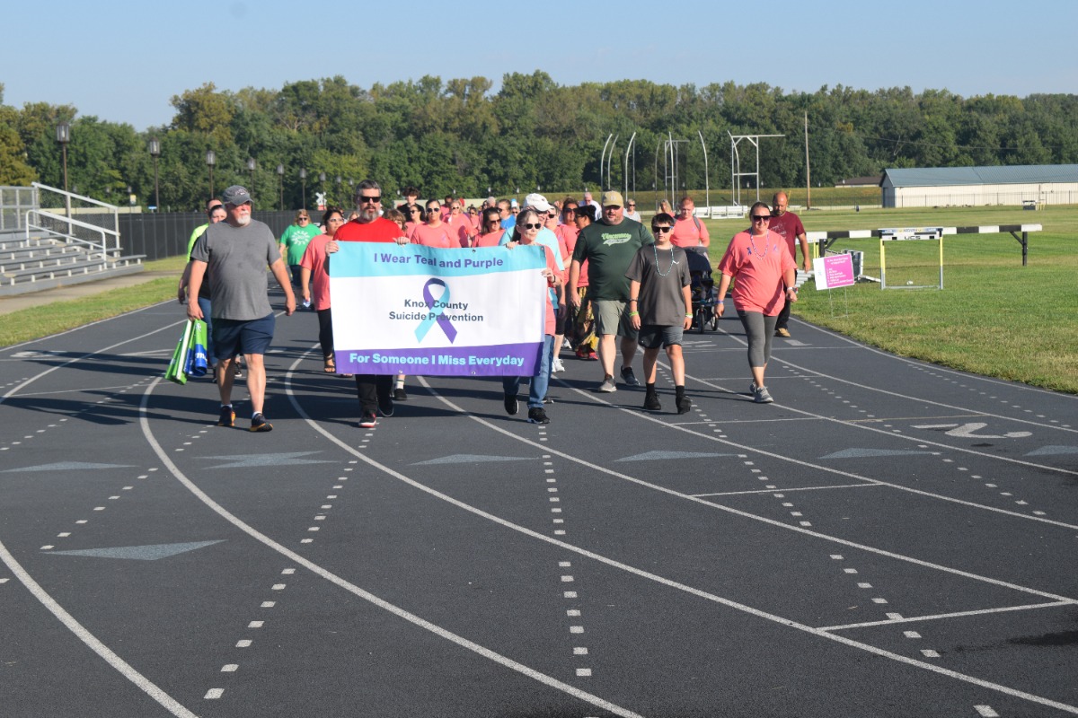 Participants walk on the Vincennes University track last year during the September Suicide Awareness Walk. 