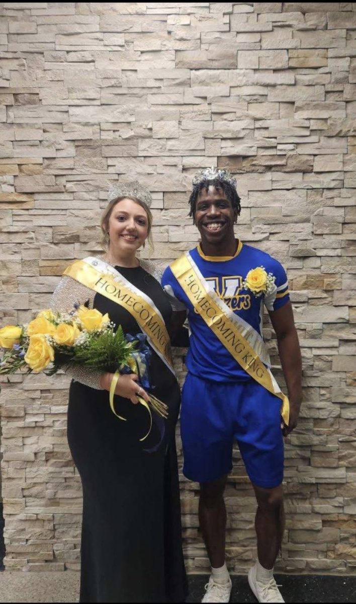 (Left to right) Bailey Hardwick and Keishawn "KT"Thomas pose for photos after being crowned Homecoming King And Queen.