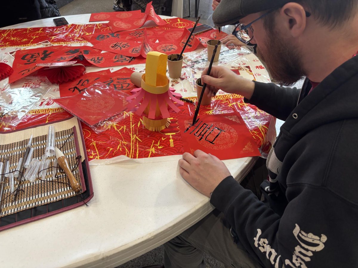 A student participates in a craft at a Lunar New Year celebration held on Feb. 17 at the Jefferson Student Union.